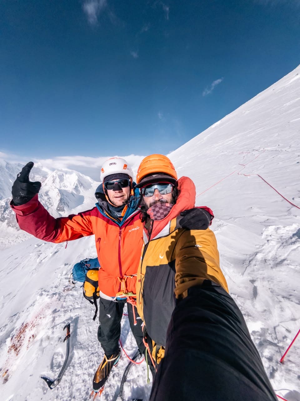 Mueez and climbing partner on a snow slope during the Zindabad ascent